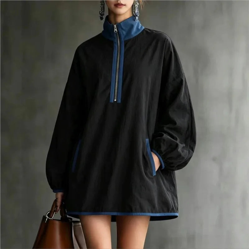 Black mini dress with blue stand collar and half zip