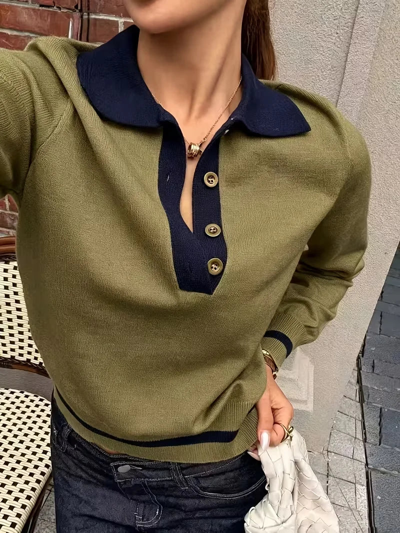 Close-up of army green polo sweater with contrast navy collar and buttons