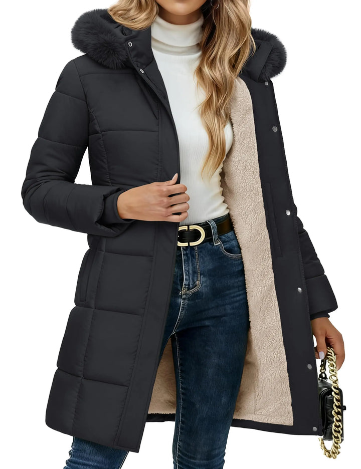 Black quilted puffer coat with faux fur hood, close up front view