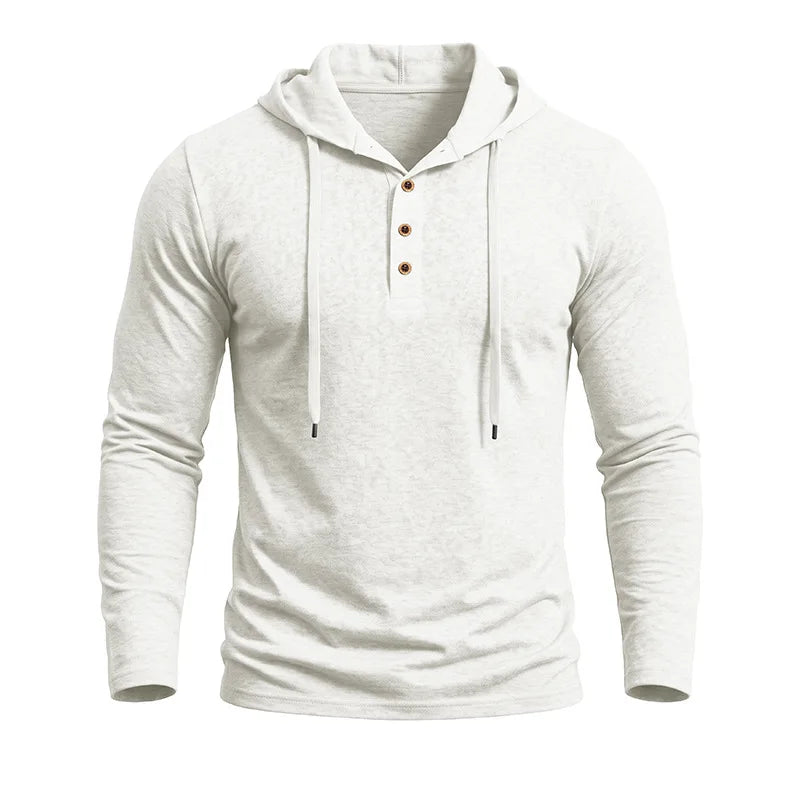 Close-up of white hooded pullover showing button placket and drawstring hood