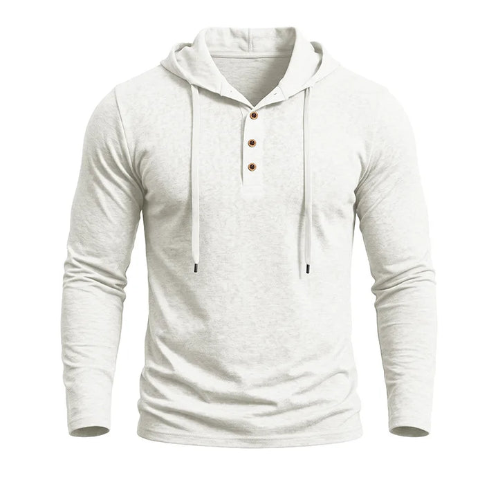 Close-up of white hooded pullover showing button placket and drawstring hood