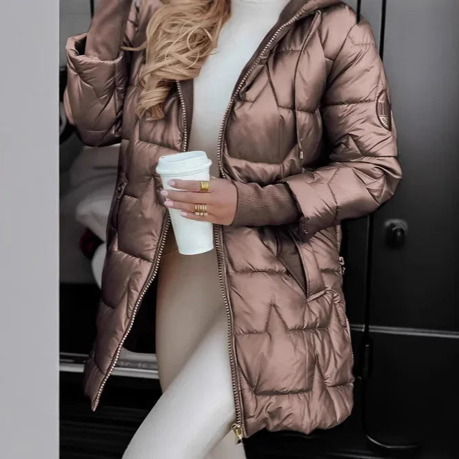 Woman wearing khaki quilted mid length puffer jacket with hood
