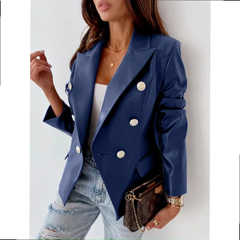 Woman wearing blue faux leather double breasted blazer