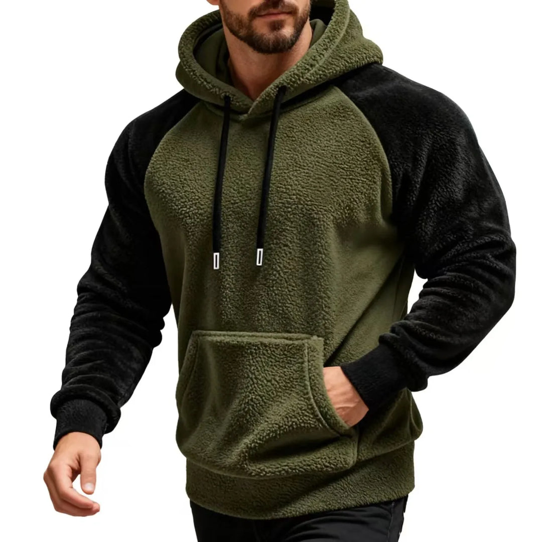 Man wearing army green and black sherpa fleece hoodie with drawstring hood