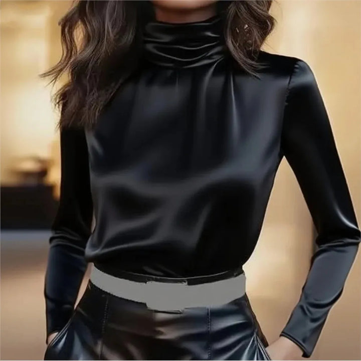 Woman wearing black satin turtleneck blouse, close up front view