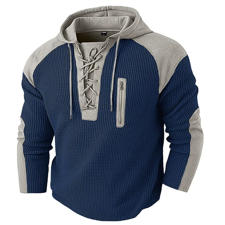 Navy waffle knit hoodie with lace-up placket and zip pocket