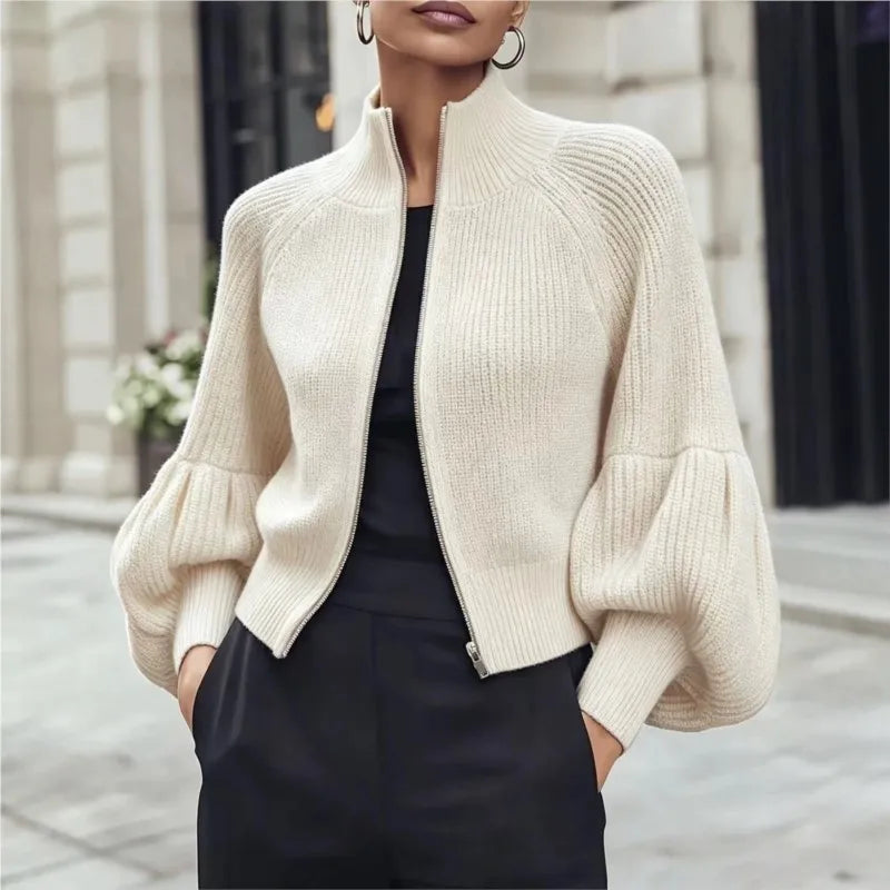 Creamy-white ribbed knit cardigan with lantern sleeves, front view