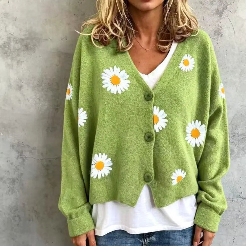 Woman wearing green daisy embroidered cardigan