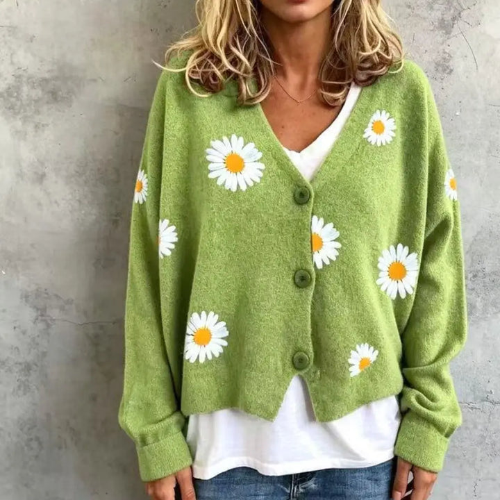 Woman wearing green daisy embroidered cardigan