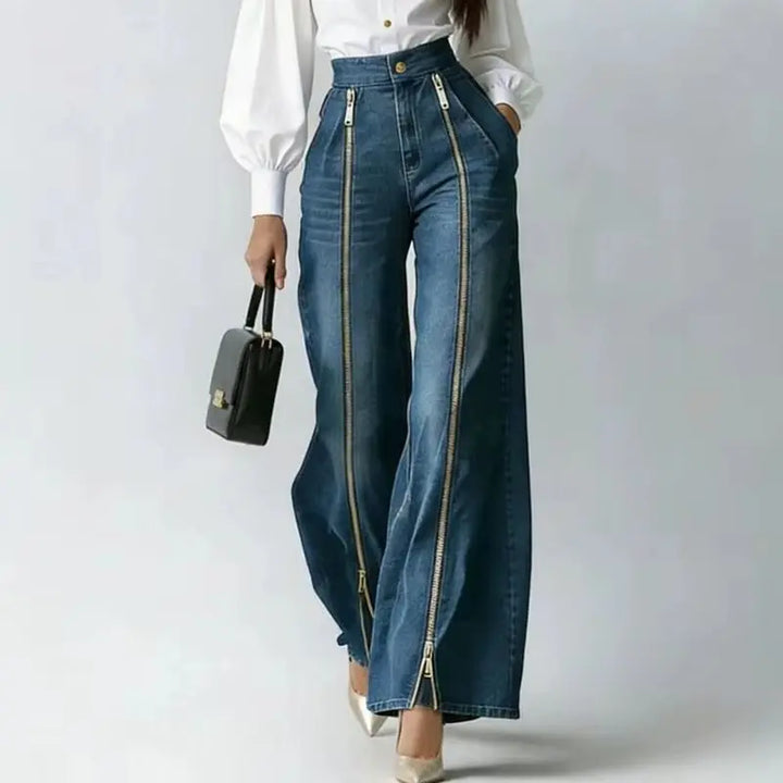 Close up front view of denim jeans with dual gold zippers