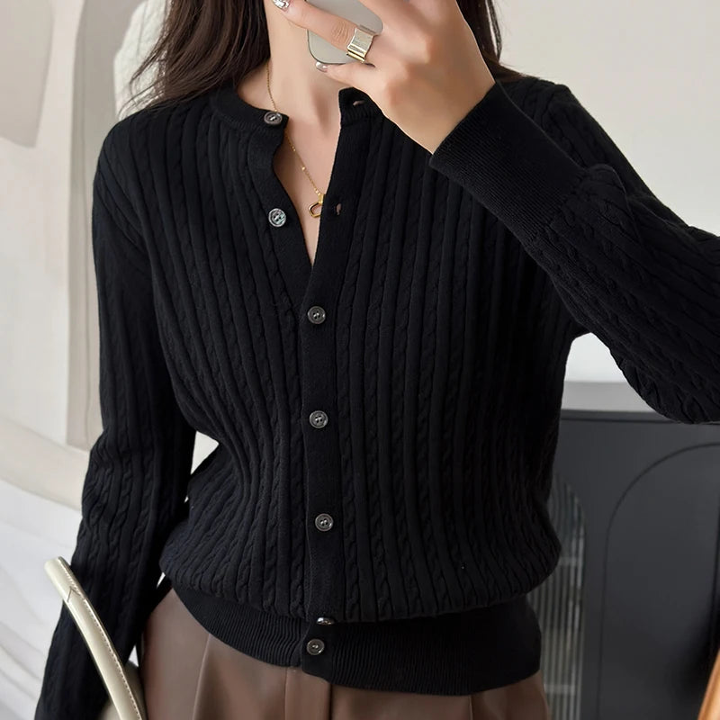Black cable knit cardigan close up buttons