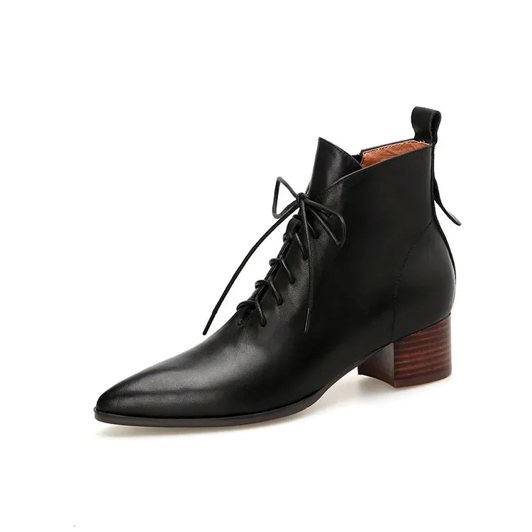 Black leather lace-up ankle boot on white background, angled view
