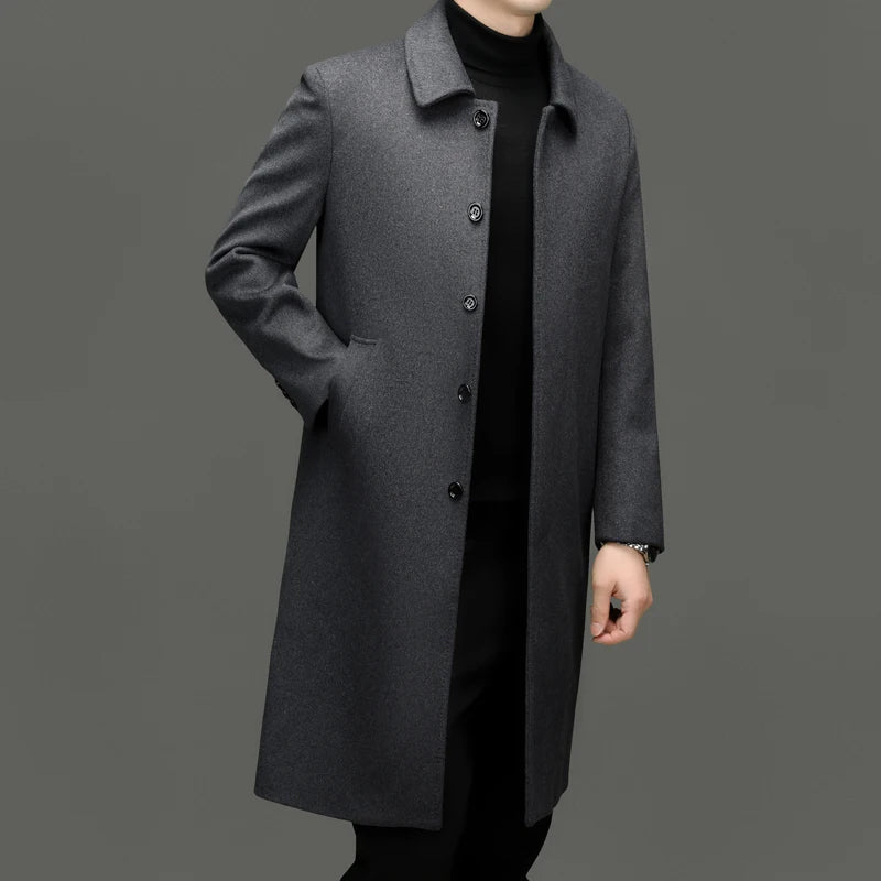 Man wearing grey mid-length wool coat, three-quarter view