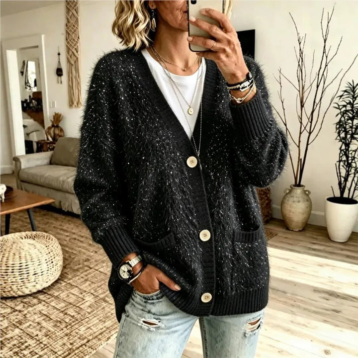 Woman wearing black sequin eyelash-knit cardigan with pockets