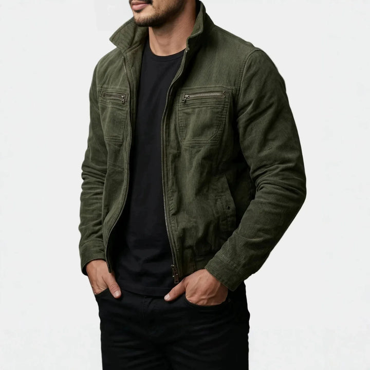 Man wearing olive green corduroy moto jacket, side angle view