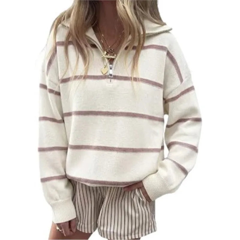 Woman wearing cream and mauve striped quarter-zip sweater