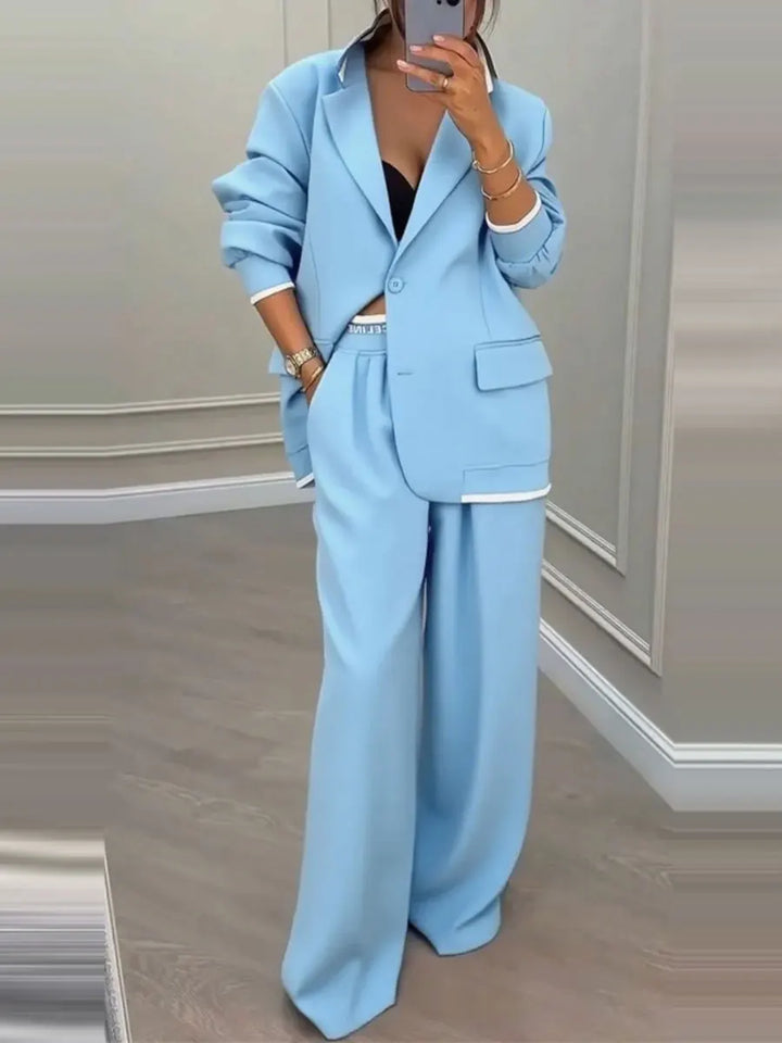 Sky blue two piece blazer and wide leg trouser suit, front view