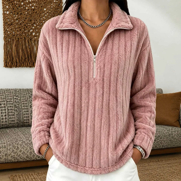 Woman wearing pink ribbed quarter-zip pullover