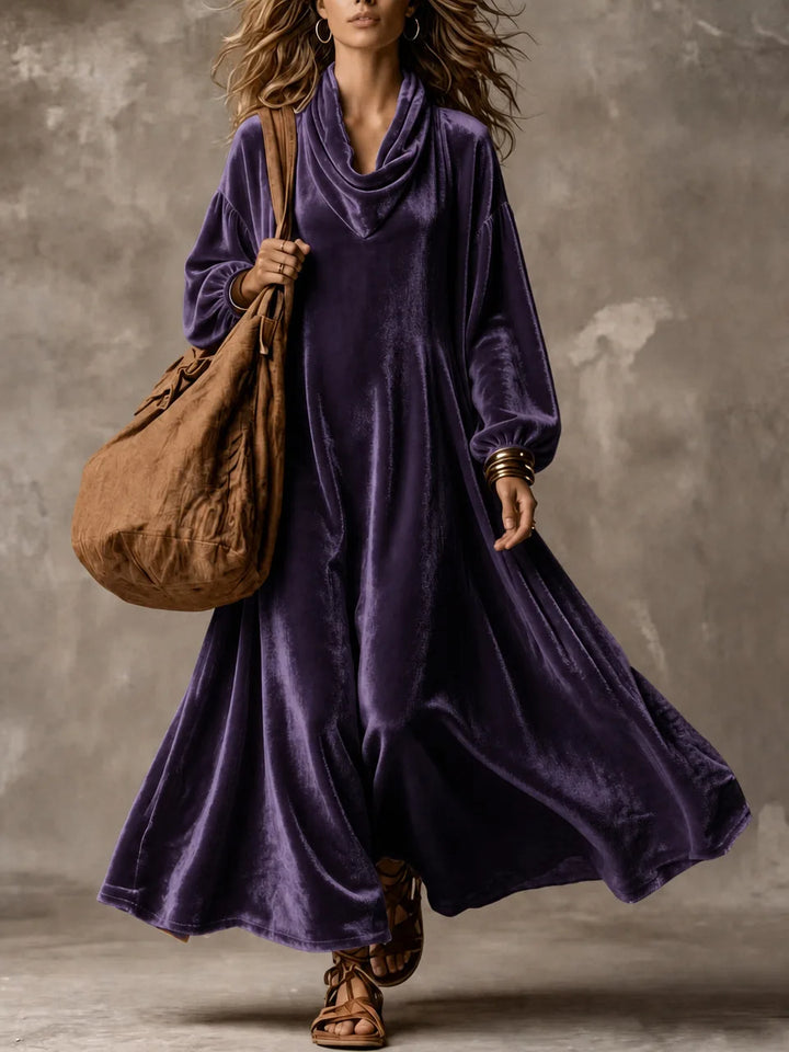 Woman wearing purple velvet cowl neck maxi dress