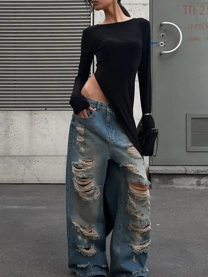 Front view of black side slit maxi dress with ripped jeans