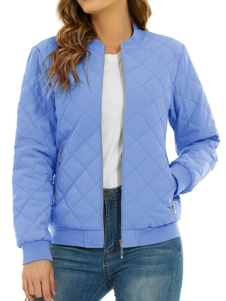 Close up of light blue quilted bomber jacket with zip pocket