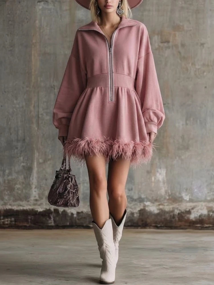 Pink half-zip sweatshirt mini dress with feather trim hem, front view