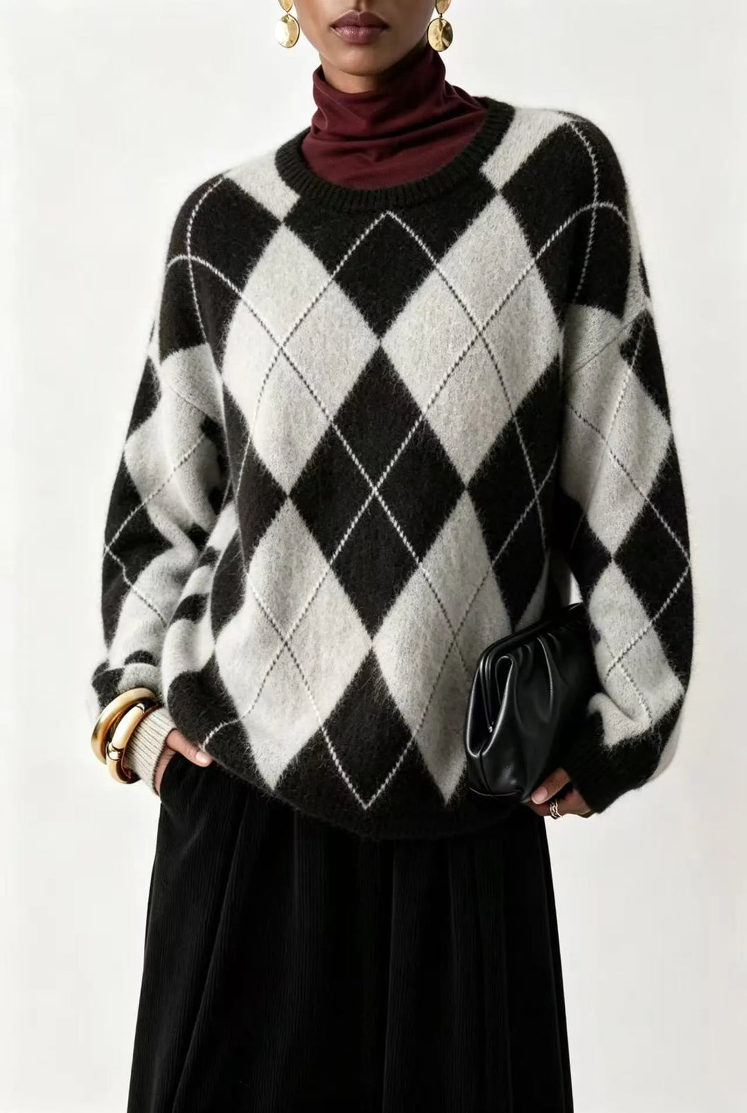 Woman wearing black and white argyle knit sweater