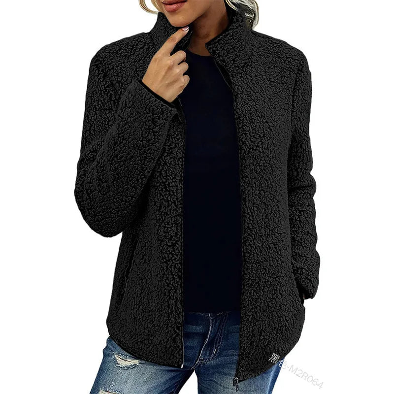 Woman wearing black sherpa fleece zip jacket