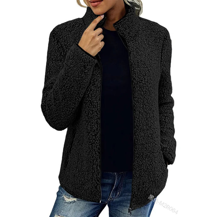 Woman wearing black sherpa fleece zip jacket