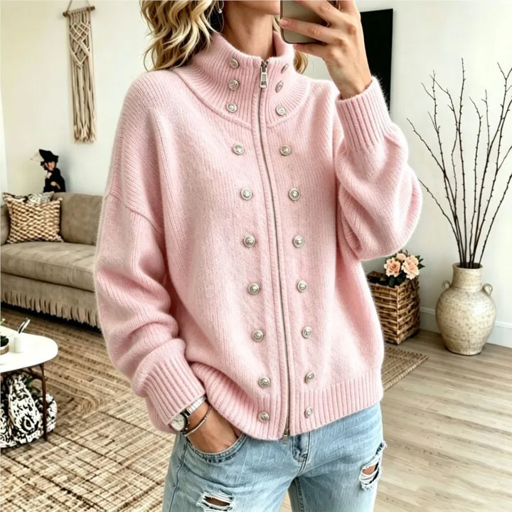 Woman wearing pink stand collar zip cardigan with button details