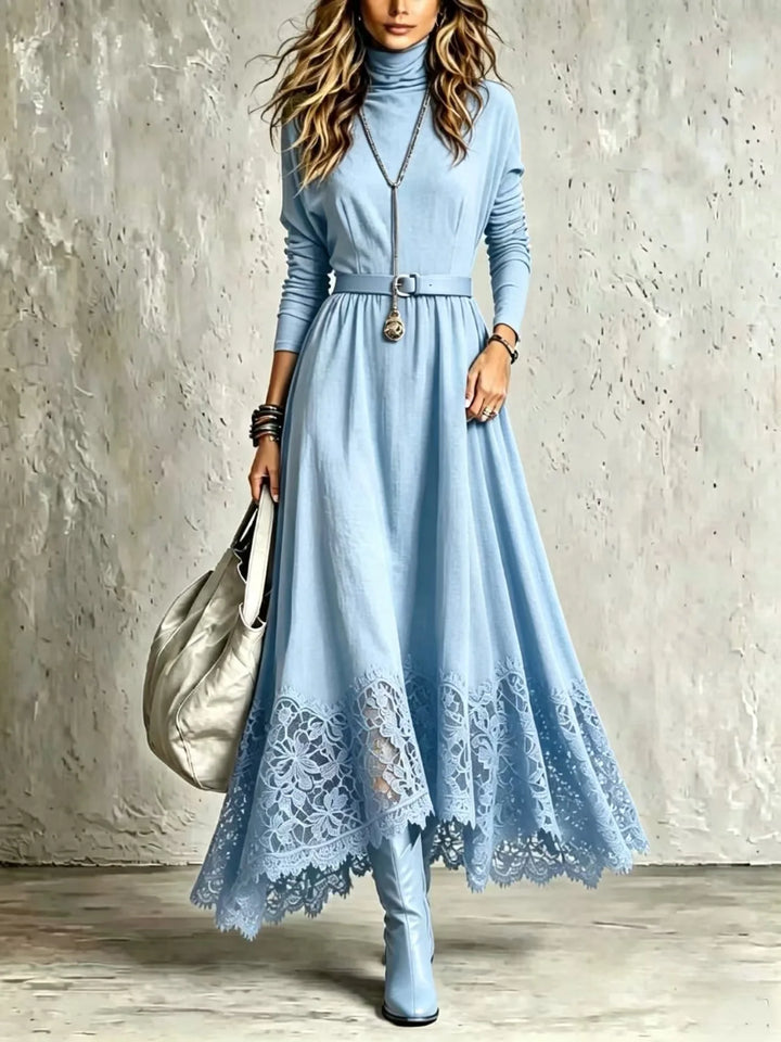 Woman wearing light blue turtleneck maxi dress with lace hem