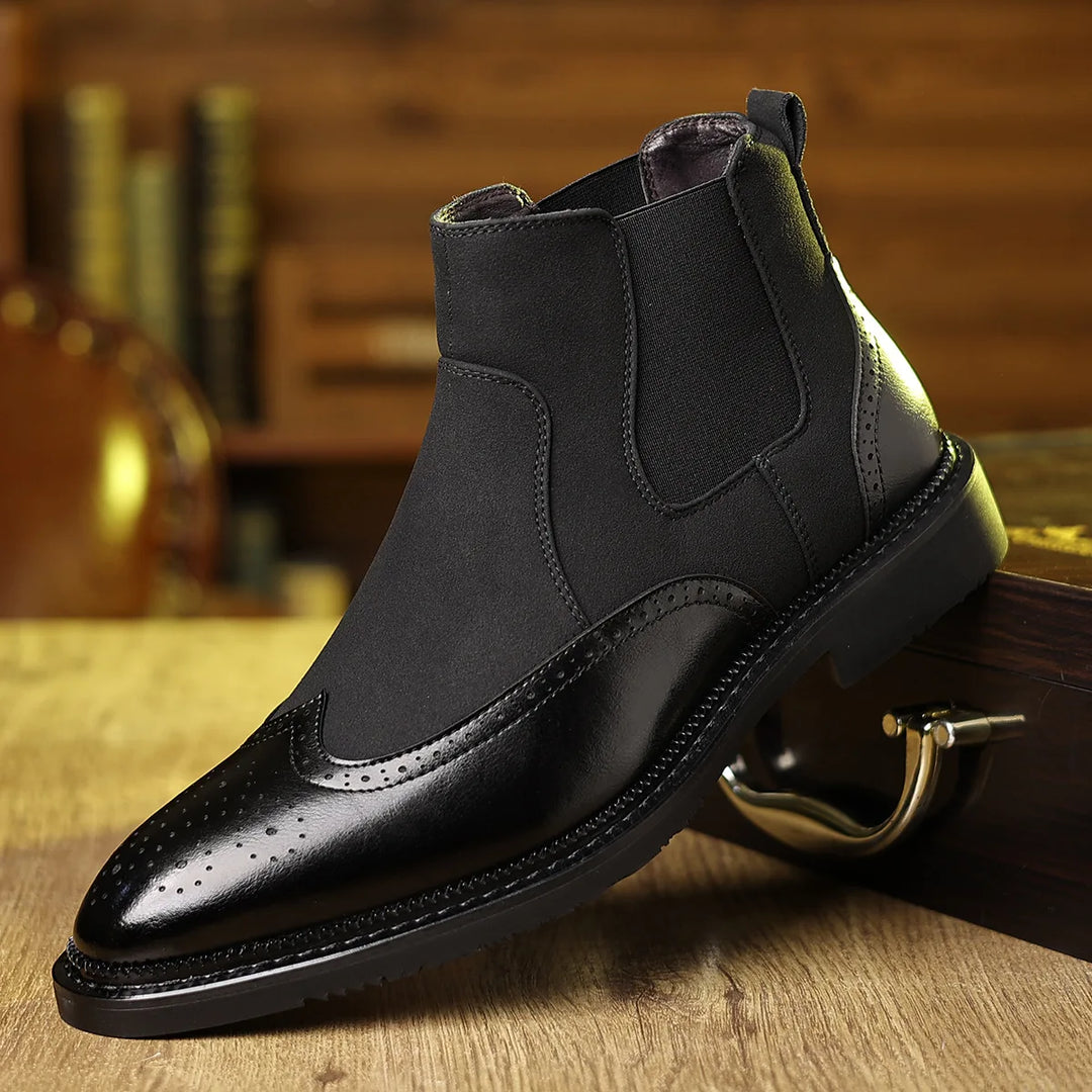 Black Chelsea boot with brogue detailing, side angle