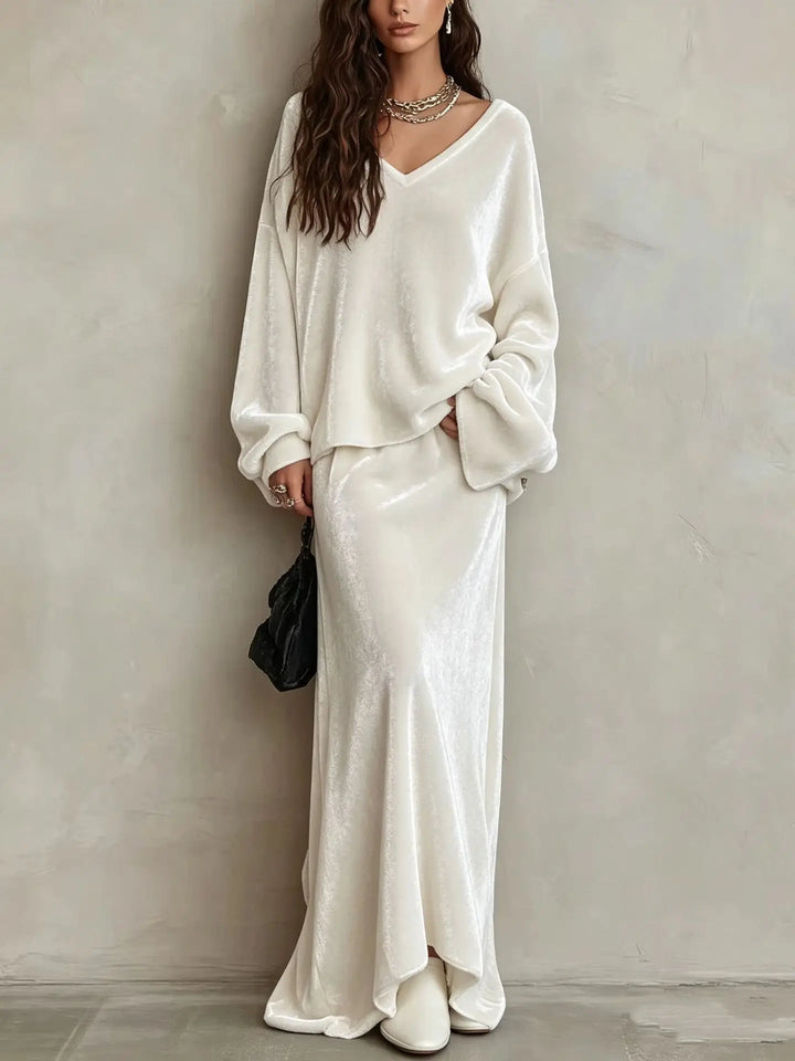 Close up of white velvet V neck pullover and maxi skirt set
