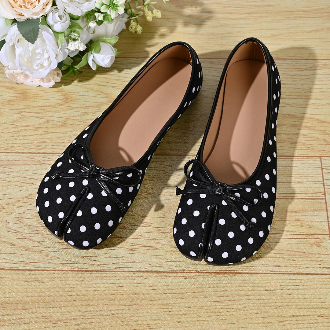 Black and white polka dot ballet flats top view