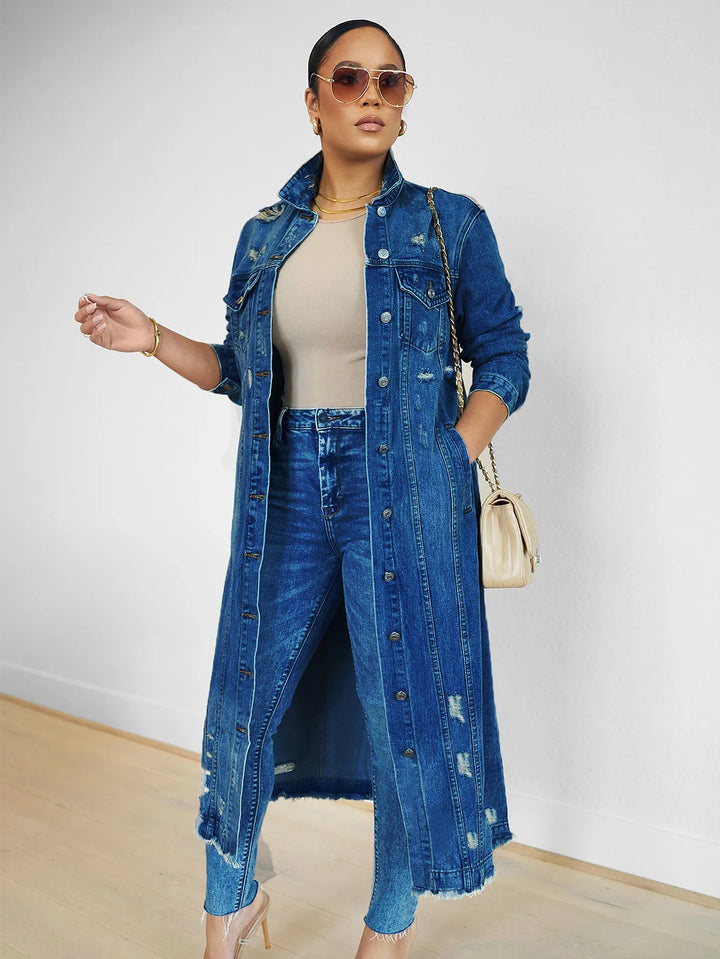 Model in dark blue denim trench coat with sunglasses