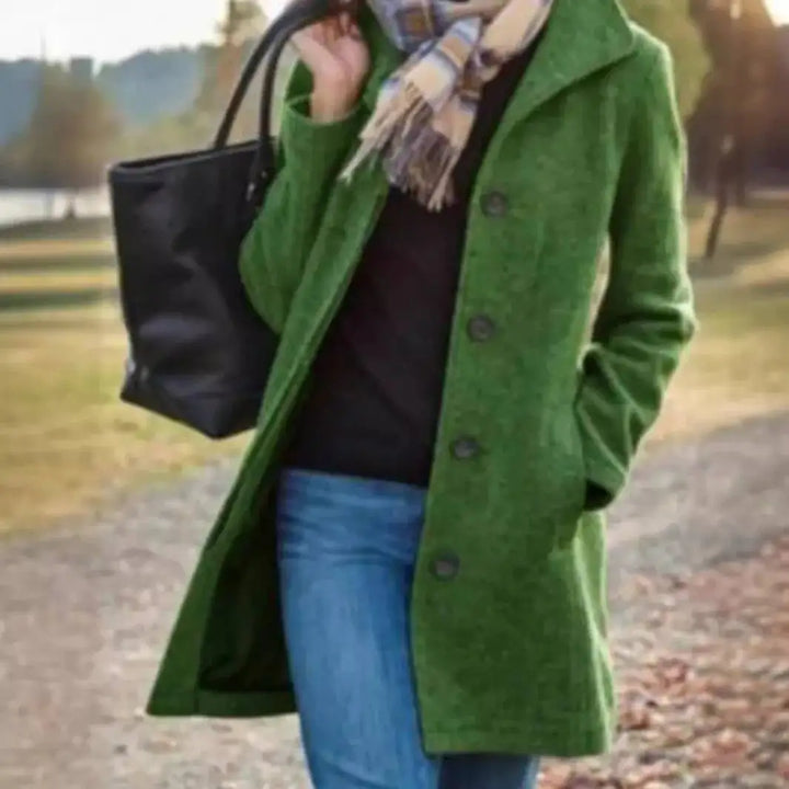 Close view of green wool coat with button front
