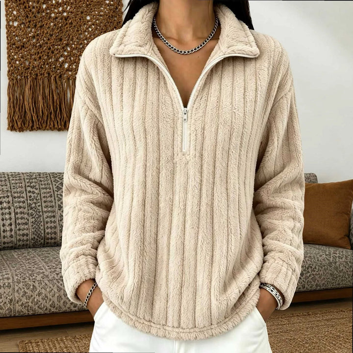 Woman wearing apricot ribbed quarter-zip pullover