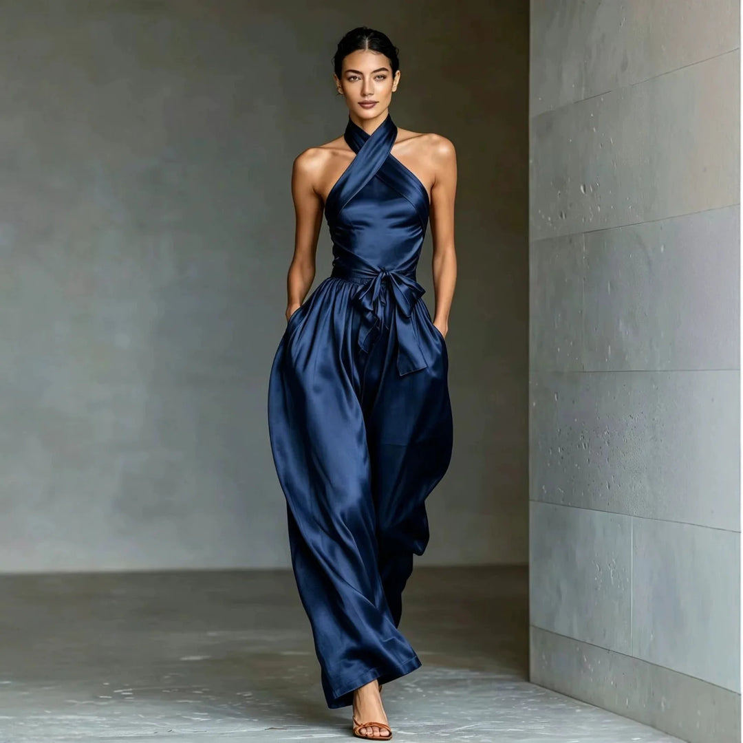 Navy blue satin halter jumpsuit with wide leg and tie waist