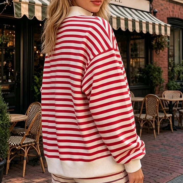 Back view of red and white striped mock neck sweatshirt