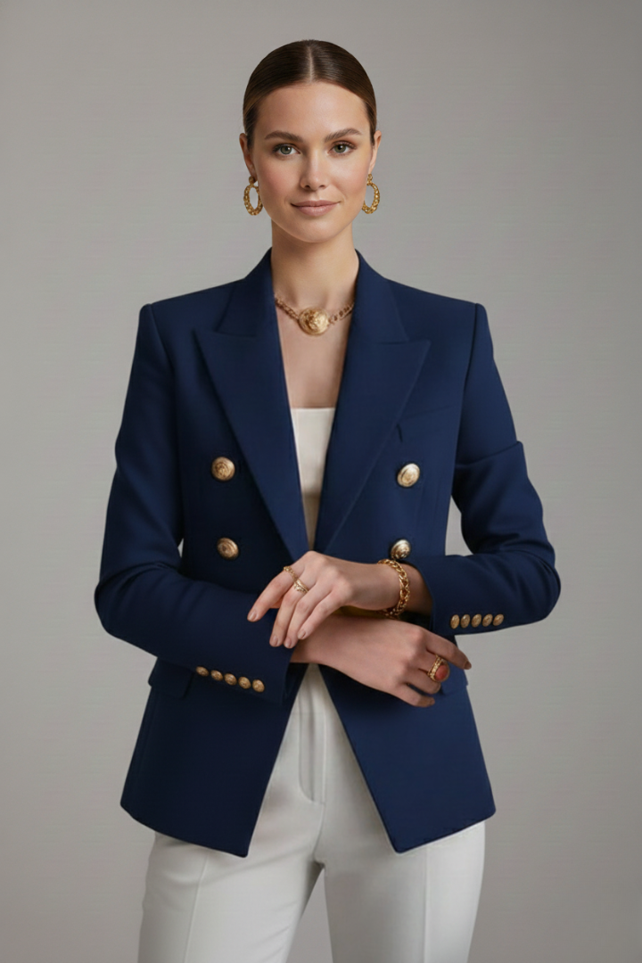 Model wearing navy blue double-breasted blazer with gold-tone buttons