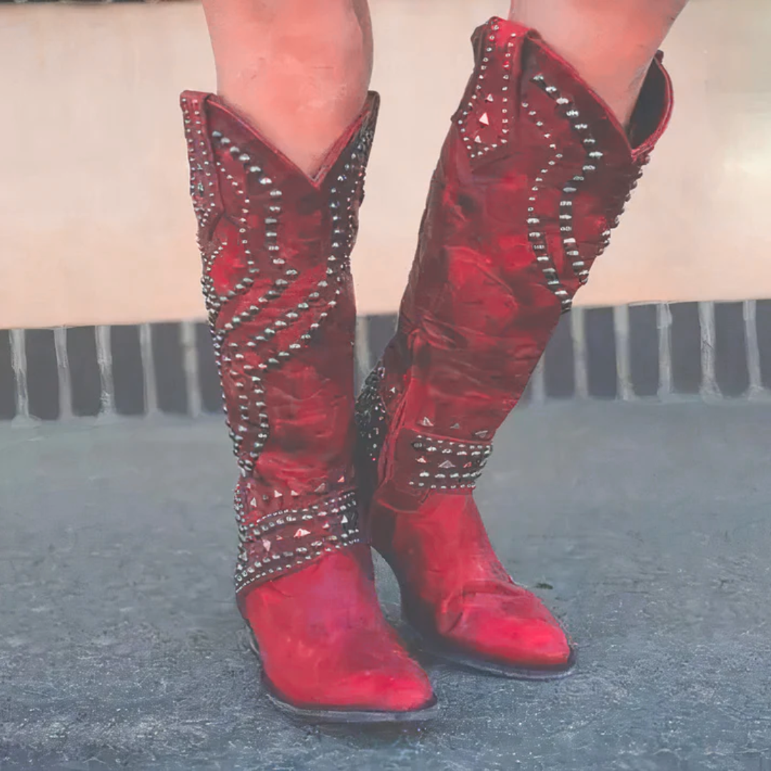 Red studded knee-high western boots front view