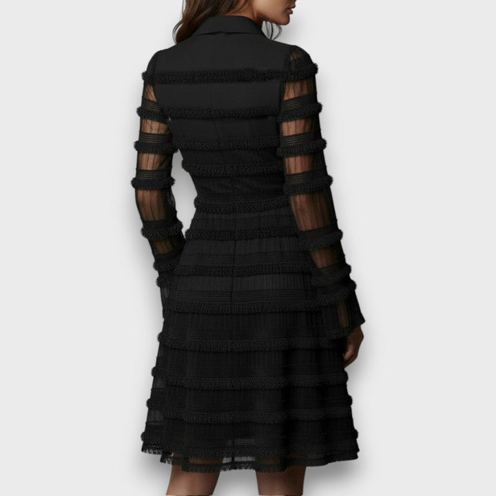 Back view of black tiered fringe dress with point collar