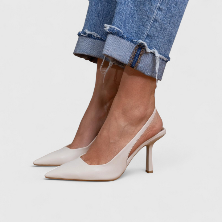 White slingback pointed-toe pump on model