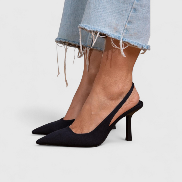 Black slingback pointed-toe pump on model