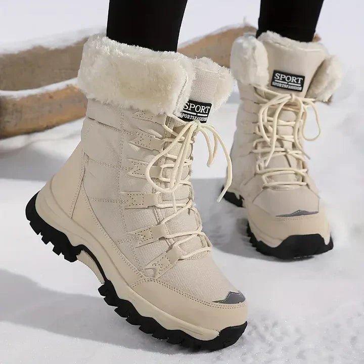 Beige snow boot with faux fur collar, front view