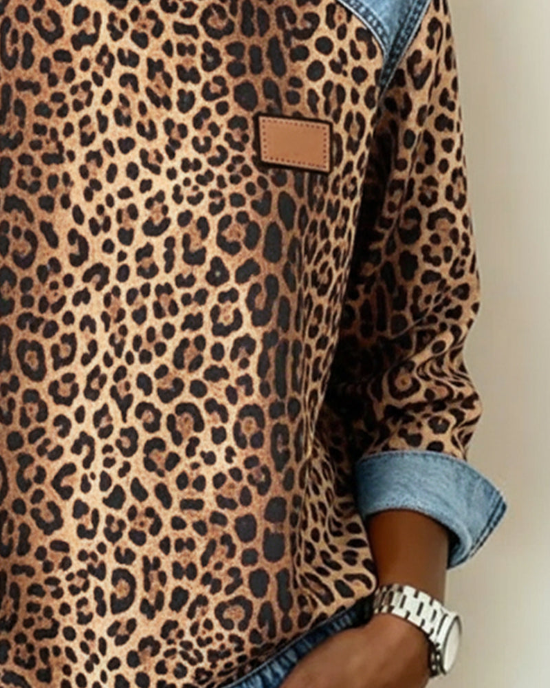 Close up of faux leather chest patch on brown leopard sweatshirt