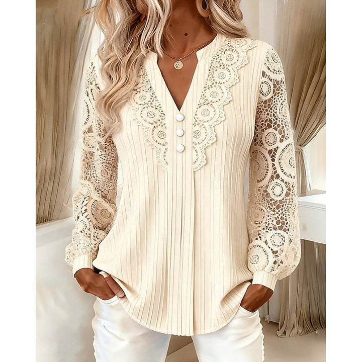 Beige ribbed blouse with crochet lace sleeves and V-neckline