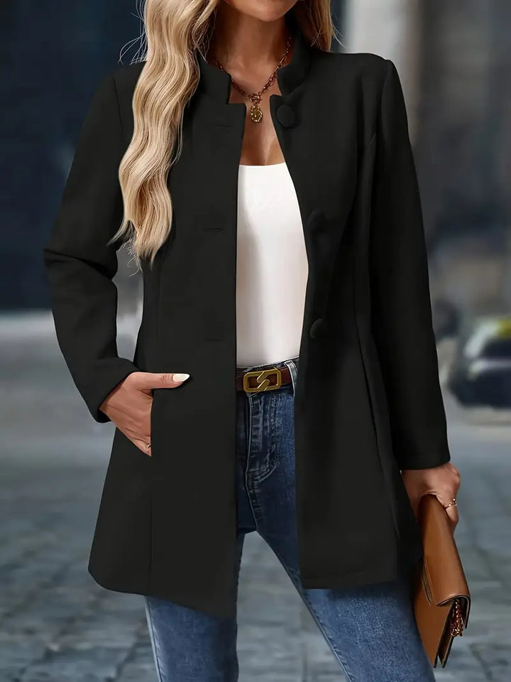 Black stand collar coat with covered buttons, front view