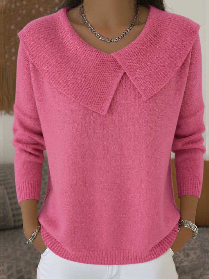 Woman wearing pink sweater with folded ribbed collar