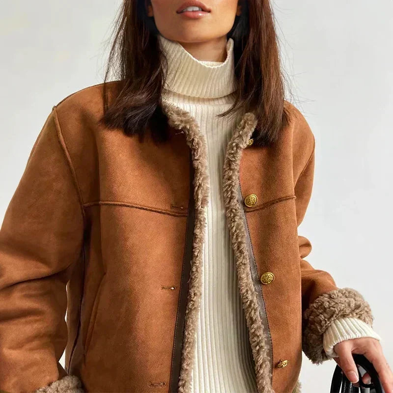 Close up of shearling jacket collar and gold snap button closures